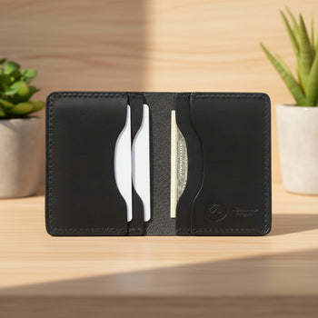 Black leather wallet with card slots on a white background