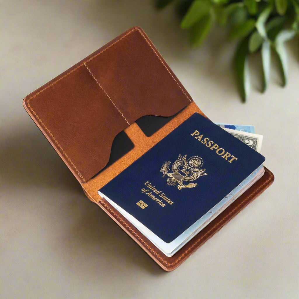 Brown leather passport holder with a blue passport on a light surface.