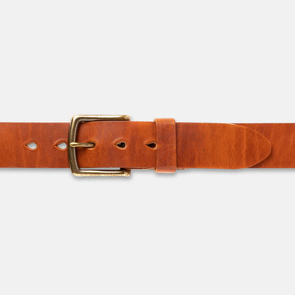 Brown leather belt with a brass buckle on a light gray background